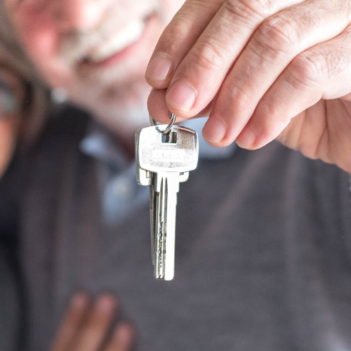 Hands holding up keys